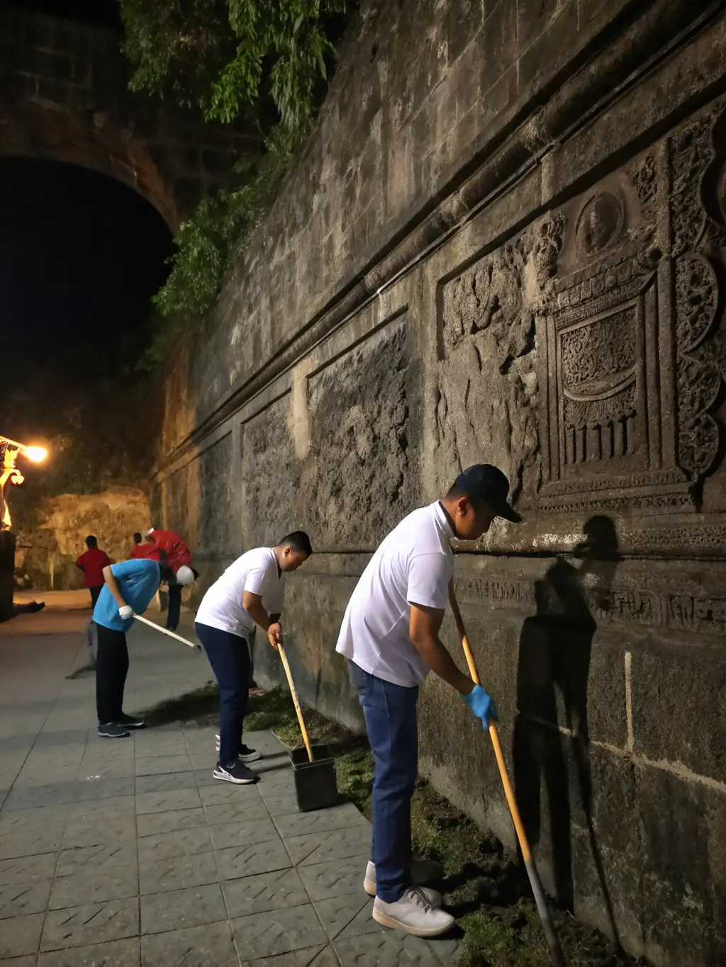 A picture of a cultural heritage preservation project, showing volunteers and experts working together to restore a historical site, demonstrating TOUPIE BOLKI's commitment to preserving cultural heritage.